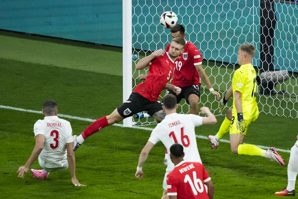 Turkey's Merih Demiral, left, scores the opening goal during a round of sixteen match between Austria and Turkey at the Euro 2024 soccer tournament in Leipzig, Germany, Tuesday, July 2, 2024. (AP Photo/Ebrahim Noroozi)