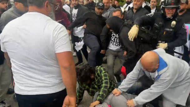 PHOTO: Police break up a fight outside the Glendale School District Building in Los Angeles County, Calif., June 6, 2023, where a district meeting on LGBTQ Studies was being held. (Sergio Olmos via Storyful)