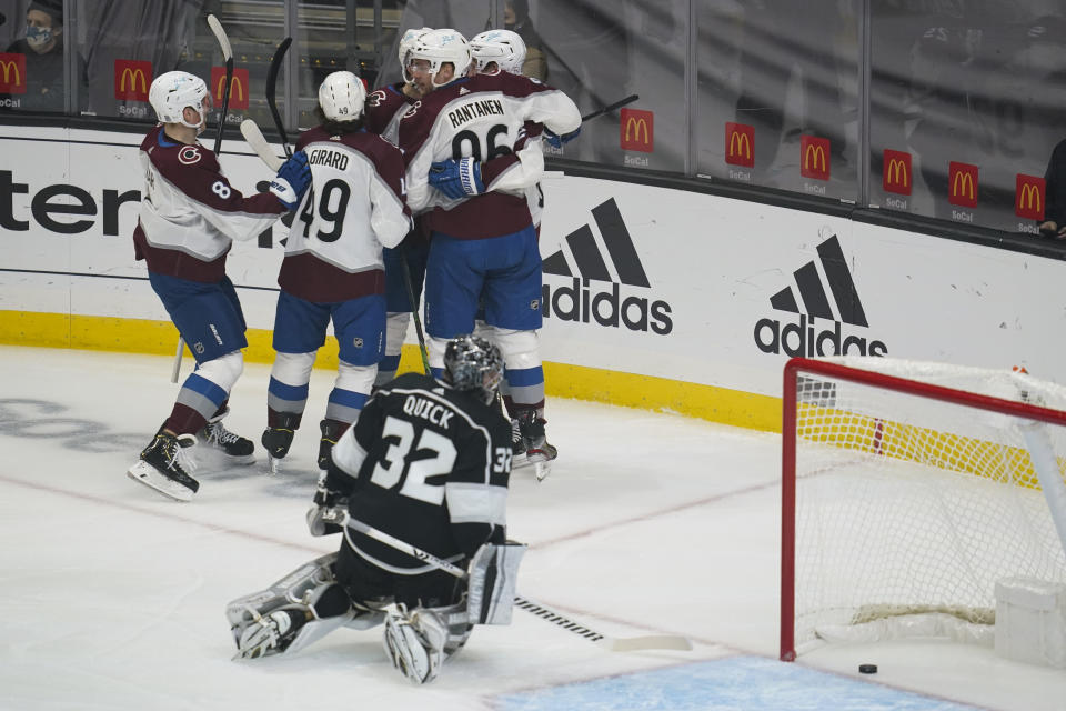 Colorado Avalanche players celebrate after a goal by right wing Mikko Rantanen (96) against the Los Angeles Kings during the first period of an NHL hockey game Thursday, Jan. 21, 2021, in Los Angeles. (AP Photo/Ashley Landis)