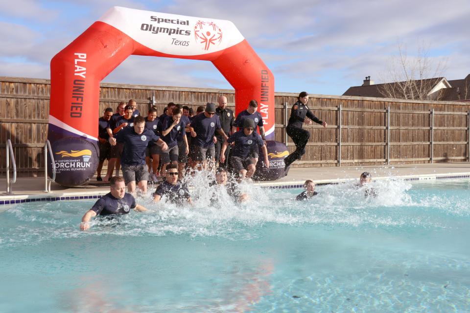 Students from the Amarillo Police Academy get cold and wet as they participate in the annual Special Olympics Polar Plunge at Amarillo Town Club on Hillside Saturday morning.