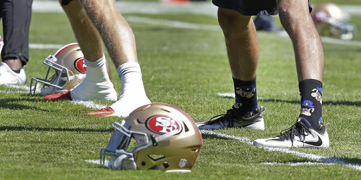 Colin Kaepernick wore these socks during practice on Aug. 10. (AP)