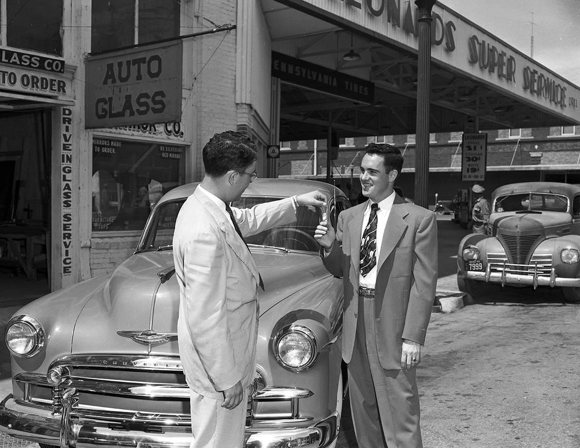 June 28, 1950: Paul Leonard, left, one of the owners of Leonard’s Department Store, presents keys to a new car awarded Harry Ottman, of 1333 Woodland, as first prize in a Tarrant County census estimating contest conducted by the store.