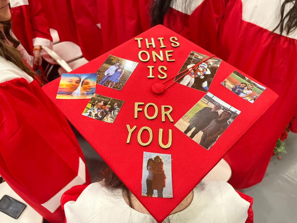 Alexandria Dye's mortarboard is decorated in memory of her sister, who passed away two years ago from cancer. For Dye, it was a way to bring her to the graduation.