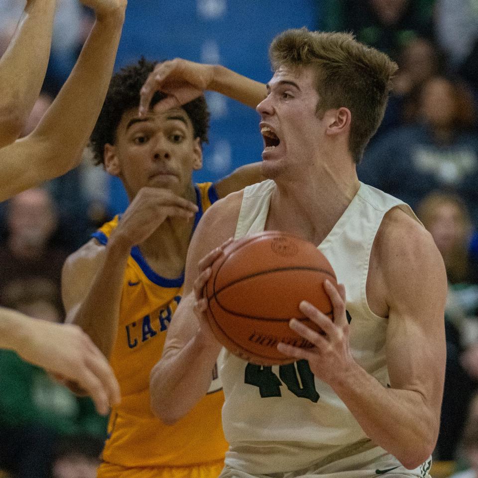 Westfield High School's Alex Romack (40) pounds toward the paint at Carmel High School, Tuesday, Feb. 28, 2023, during the Westfield boys’ sectional win over Carmel, 43-40. 