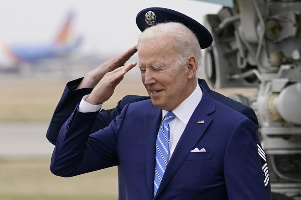 President Joe Biden salutes as he arrives on Air Force One at Des Moines International Airport, in Des Moines Iowa, Tuesday, April 12, 2022, en route to Menlo, Iowa. (AP Photo/Carolyn Kaster)