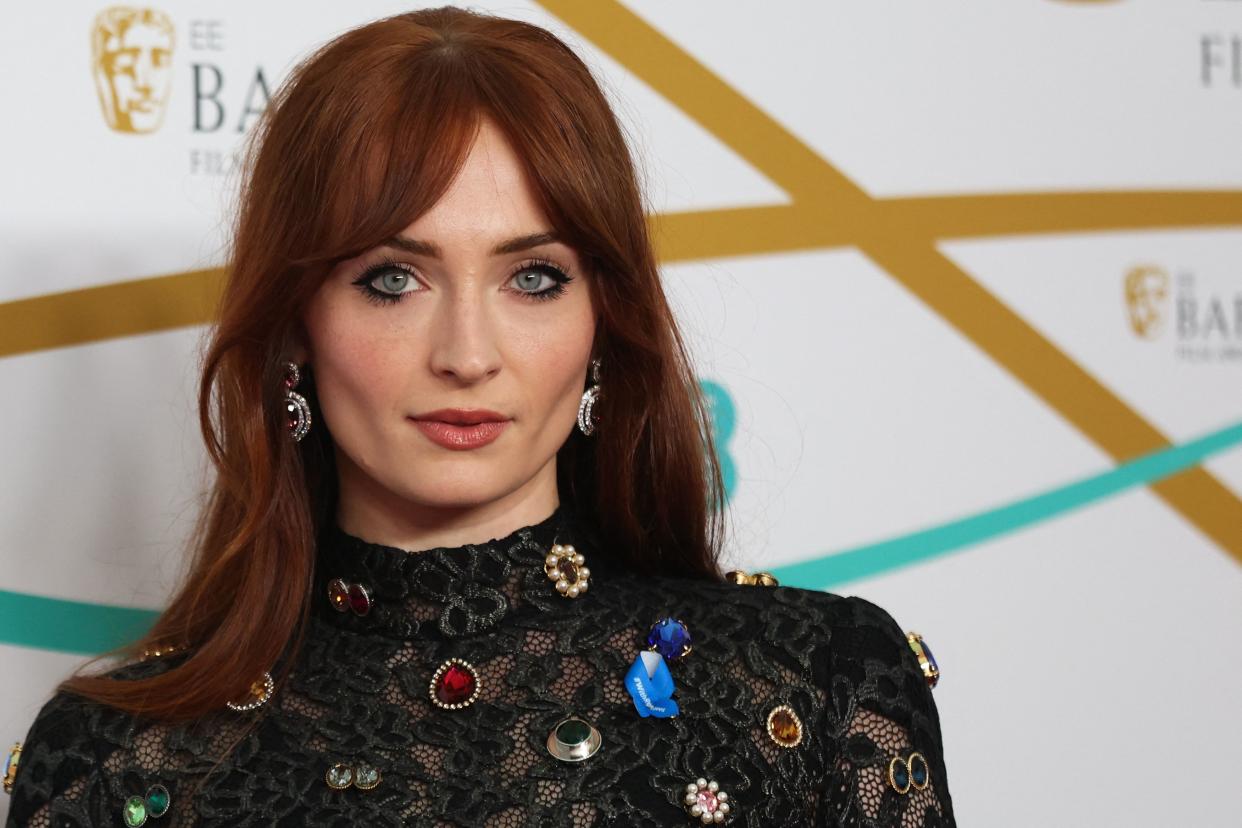 British actress Sophie Turner poses on the red carpet upon arrival at the BAFTA British Academy Film Awards at the Royal Festival Hall, Southbank Centre, in London, on February 19, 2023. (Photo by ISABEL INFANTES / AFP) (Photo by ISABEL INFANTES/AFP via Getty Images)