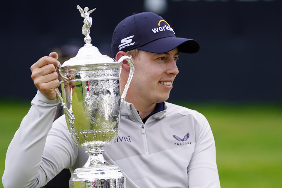 Matthew Fitzpatrick, of England, poses with the trophy after winning the U.S. Open golf tournament at The Country Club, Sunday, June 19, 2022, in Brookline, Mass. (AP Photo/Julio Cortez)