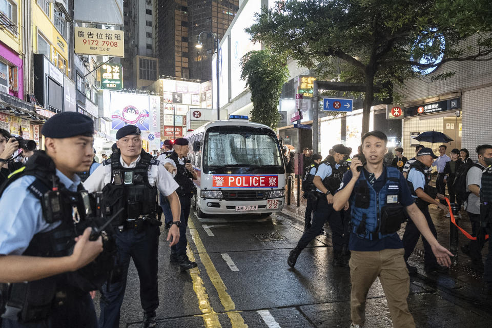 The Police van which detained performance artist Sanmu Chen leaves the Causeway Bay area on the eve of the 35th anniversary of China's Tiananmen Square crackdown in Hong Kong, Monday, June 3, 2024. (AP Photo/Chan Long Hei)