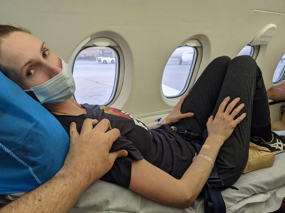 Andrea Prudente, being comforted during her medical emergency flight. (Courtesy Jay Weeldreyer)