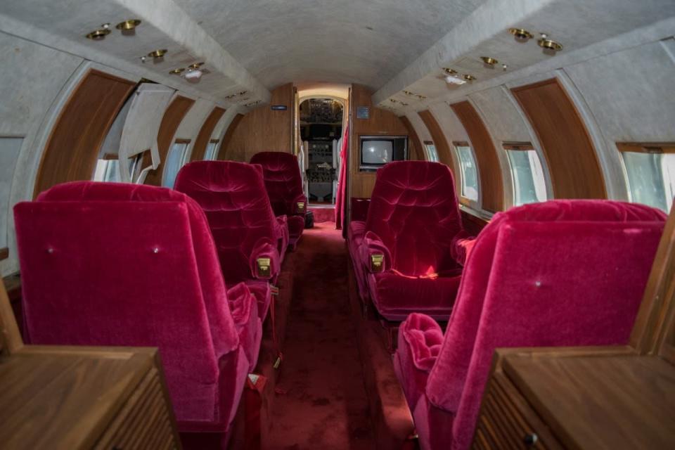 The red velvet interior of the Lockheed Jetstar - Credit: Liveauctioneers.com