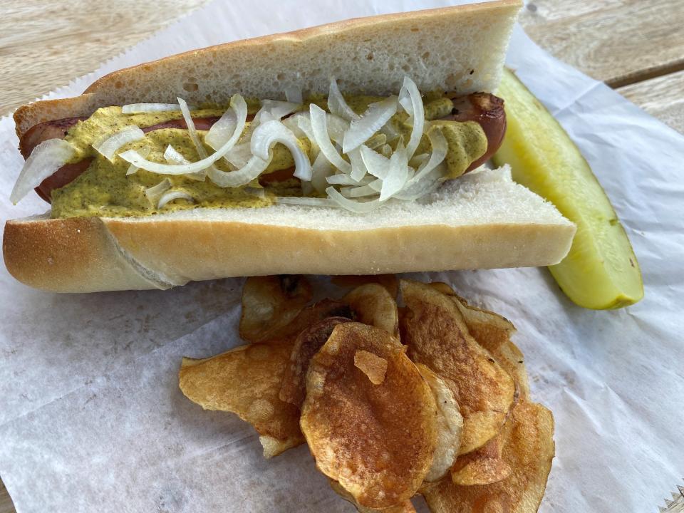 A housemade hot dog on Calandra's bakery bread at Forked River German Butcher Shop in Lacey.