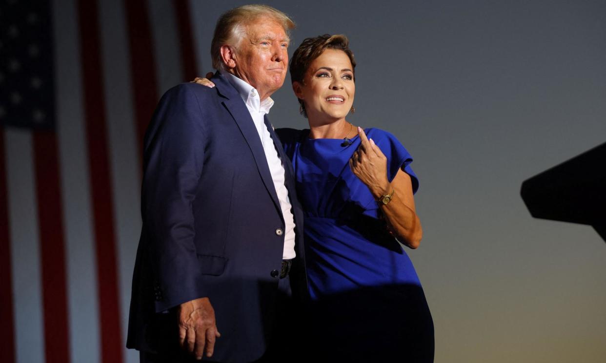 <span>Donald Trump and Kari Lake in Mesa, Arizona, on 9 October 2022.</span><span>Photograph: Brian Snyder/Reuters</span>