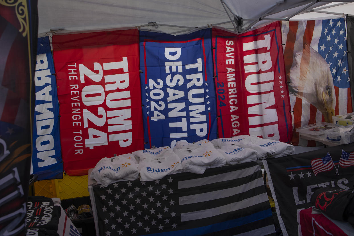 A booth at the Fryeburg Fair in Maine, lined with banners reading Trump DeSantis 2024.
