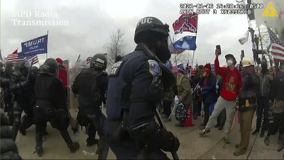 This image from video from a police worn body camera from the Jan. 6 riot at the U.S. Capitol, was played as a committee exhibit as the House select committee investigating the the Jan. 6 attack on the U.S. Capitol, held a hearing Thursday, June 9, 2022, on Capitol Hill in Washington. (House Select Committee via AP)