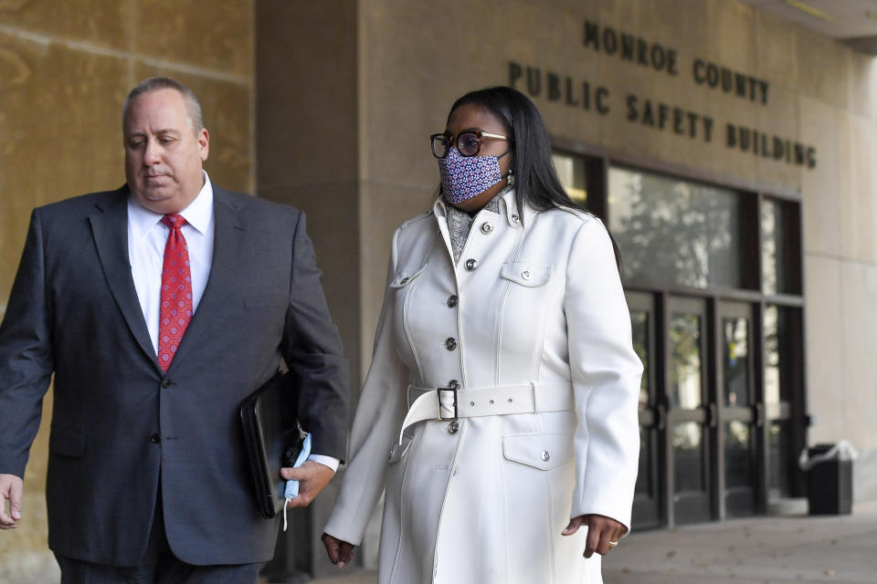 Rochester Mayor Lovely Warren, right, and her attorney Joe Damelio, left, walk to city court for arraignment in Rochester, N.Y., Monday, Oct. 5, 2020. Warren, who has faced calls to resign over her city's handling of the suffocation death of Daniel Prude at the hands of police, pleaded not guilty Monday to campaign finance charges dating to her 2017 reelection campaign. (AP Photo/Adrian Kraus)