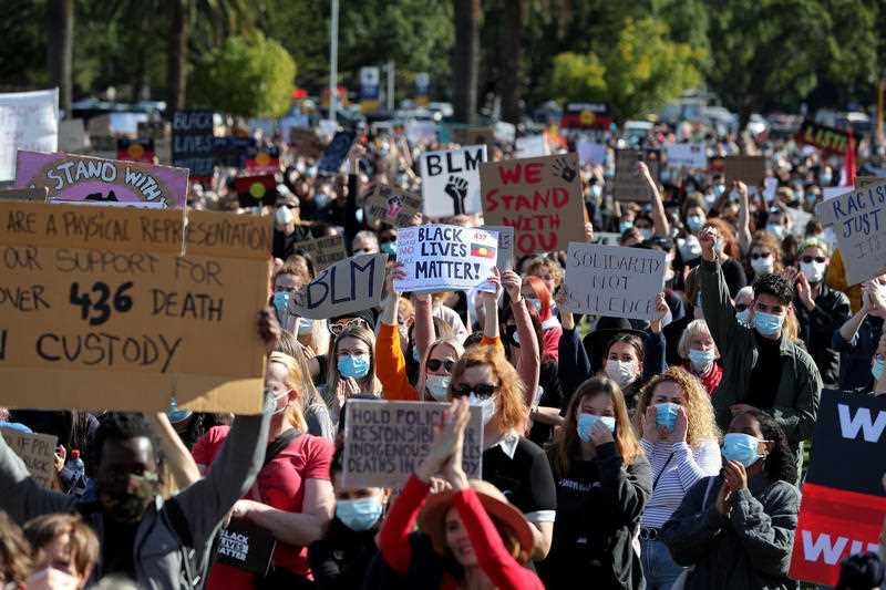 Protesters participate in a Black Lives Matter rally at Langley Park in Perth.