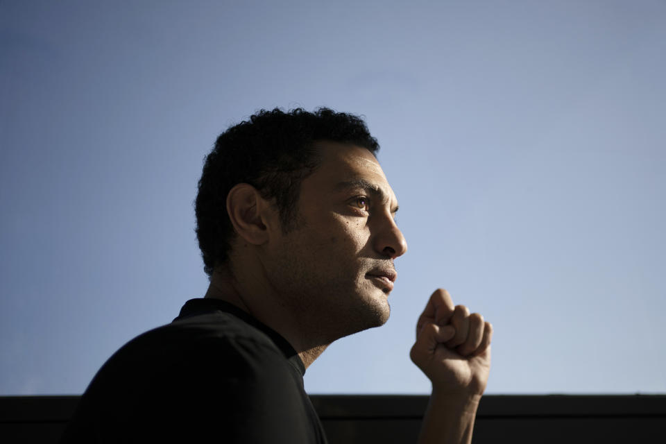 Self-exiled contractor Mohamed Ali, from Egypt, poses for a photo at an office in Spain, Tuesday, Nov. 5, 2019. Ali pitches himself as a former government insider. Without offering evidence, he says he’s witnessed high-level corruption and large-scale misuse of funds as a construction contractor for the military. (AP Photo/Felipe Dana)