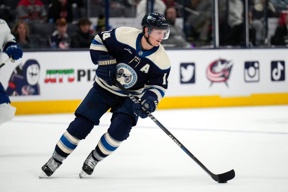 Blue Jackets forward Gustav Nyquist handles the puck against the Canucks.