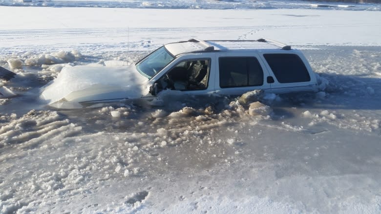 Ice fisherman and his SUV crack frozen Richibucto River and sink