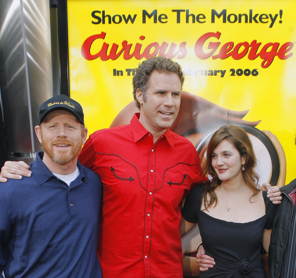 Ron Howard (L), co-producer of the animated movie 'Curious George', poses with cast members Will Ferrell (C) and Drew Barrymore at the premiere of the movie in Los Angeles, California January 28, 2006. REUTERS/Lucas Jackson