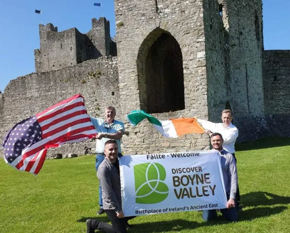 The Irish Boyne Valley Twinning Committee pose with Irish and American flags outside of the Trim Castle in County Meath. Pictured (top, from left) are Mick Huges, Gerry Meade, (bottom, from left) Micheal Kerr and David Gorey.