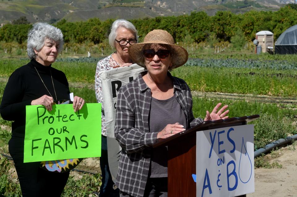 Cynthia King, who co-owns a family farm near Fillmore with husband Alan King, speaks in favor of a pair of oil measures at a news conference last month. At left is Ventura County Supervisor Carmen Ramirez.