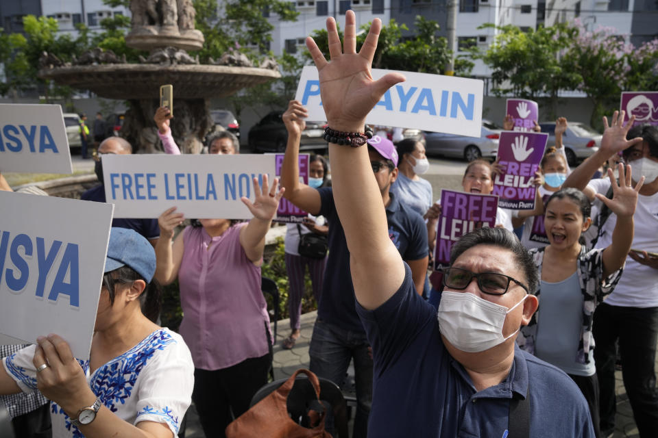 Supporters of detained former opposition Senator Leila de Lima shout slogans outside the Muntinlupa trial court on Friday, May 12, 2023 in Muntinlupa, Philippines. De Lima was acquitted by the Muntinlupa court in one of her drug related charges she says were fabricated by former President Rodrigo Duterte and his officials in an attempt to muzzle her criticism of his deadly crackdown on illegal drugs. (AP Photo/Aaron Favila)