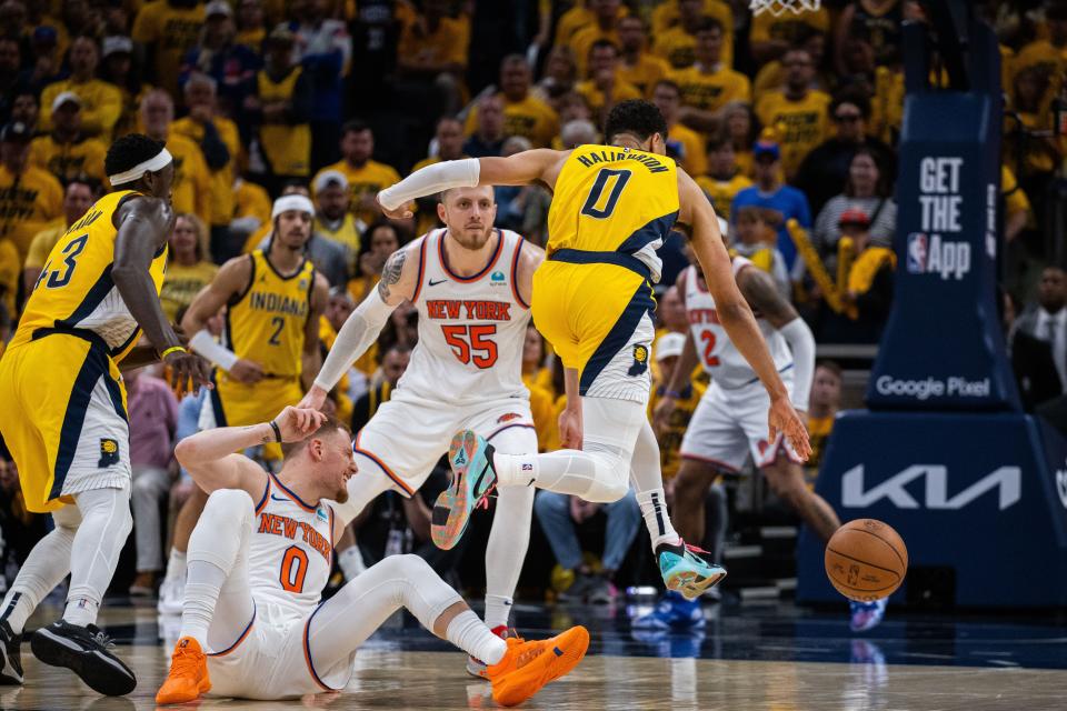 May 10, 2024; Indianapolis, Indiana, USA; Indiana Pacers guard Tyrese Haliburton (0) dribbles the ball while New York Knicks guard Donte DiVincenzo (0) defends during game three of the second round for the 2024 NBA playoffs at Gainbridge Fieldhouse. Mandatory Credit: Trevor Ruszkowski-USA TODAY Sports