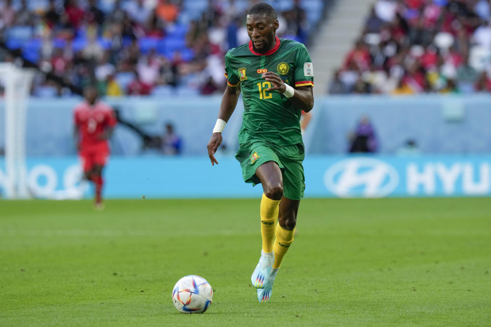 Cameroon's Karl Toko Ekambi runs with the ball during the World Cup group G soccer match between Switzerland and Cameroon, at the Al Janoub Stadium in Al Wakrah, Qatar, Thursday, Nov. 24, 2022. (AP Photo/Luca Bruno)