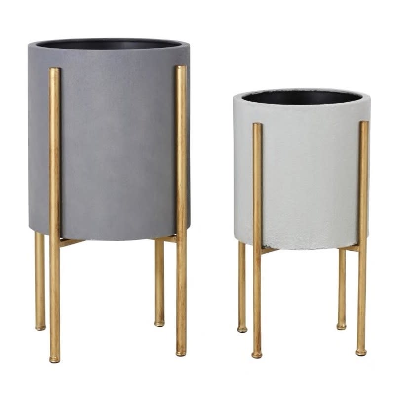 <a rel="nofollow noopener" href="https://www.overstock.com/Home-Garden/Aspire-Home-Accents-5742-Nabila-Set-of-2-Circular-Metal-Planters-with-Gold-Base/22062998/product.html" target="_blank" data-ylk="slk:SHOP NOW;elm:context_link;itc:0;sec:content-canvas" class="link ">SHOP NOW</a>: Nabila circular metal planters with gold base by Aspire Home Accents, $132 for two, overstock.com