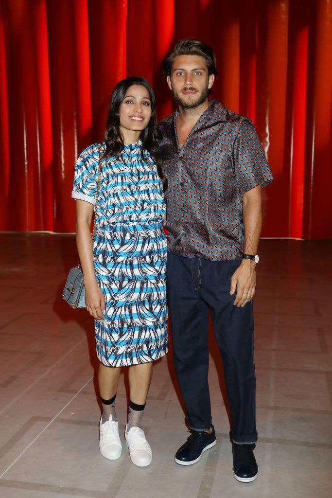 Freida Pinto (L) and Cory Tran pose together for photographers