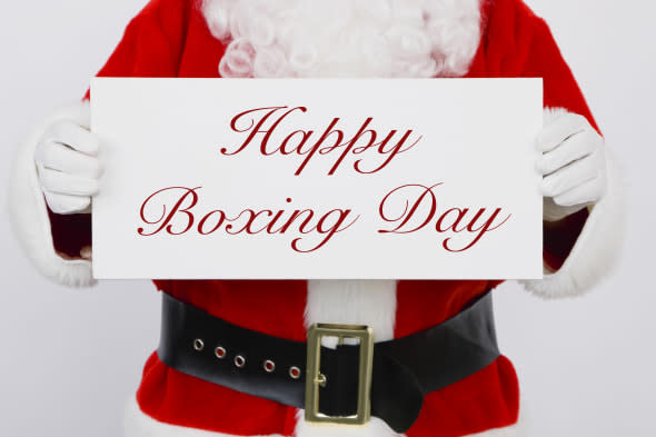 Santa Claus holding Happy Boxing Day sign