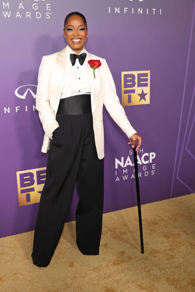 Keke in a tuxedo jacket, trousers, and cane at the NAACP Image Awards