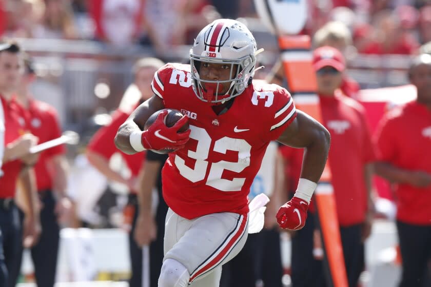 Ohio State running back TreVeyon Henderson plays against Maryland