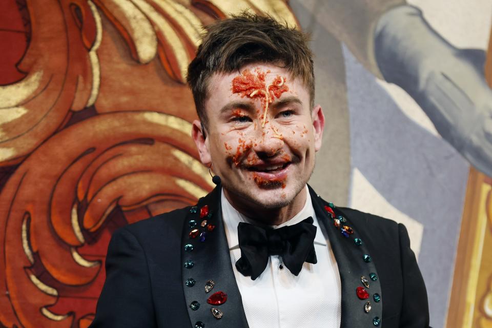 Harvard University's Hasty Pudding Theatricals Man of the Year Barry Keoghan reacts after plunging his face into a plate of spaghetti during a roast, Friday, Feb. 2, 2024, in Cambridge, Mass. (AP Photo/Michael Dwyer)