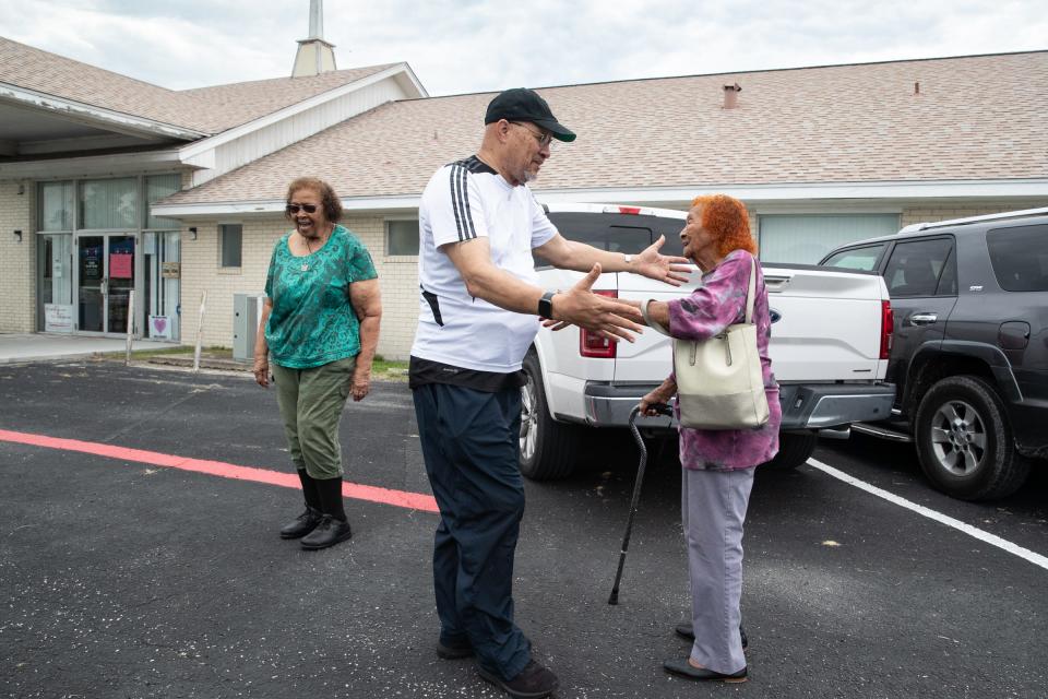 Lamont Taylor, vice president of the Hillcrest Neighborhood Association, center, greets Shirley Tipton and Hillcrest resident Alberta Yancey during the association's Neighborhood Awakening event at the Brooks AME Worship Center on Saturday in Corpus Christi.