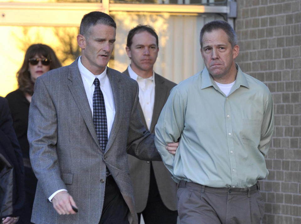 JetBlue pilot Clayton Frederick Osbon, right, is escorted to a waiting vehicle by FBI agents as he is released from The Pavilion at Northwest Texas Hospital, in Amarillo Monday, April 2, 2012. Osbon was taken directly to the Federal Court Building in Amarillo, Texas.  (AP Photo/Amarillo Globe-News, Michael Schumacher)    MANDATORY CREDIT; MAGS OUT; TV OUT