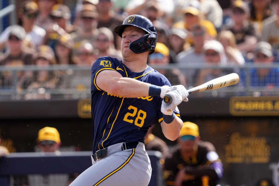 Milwaukee Brewers center fielder Joey Wiemer (28) bats during the first inning of a Spring Training game at Peoria Sports Complex.