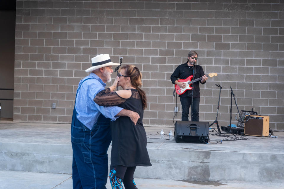 A couple enjoys a dance at the inaugural event of the new AJ Swope Performance Plaza Friday night at the Arts in the Sunset in Amarillo.