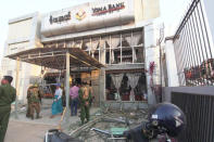 Damage and debris are seen at a bank following a bomb blast in Lashio, Myanmar February 21, 2018 in this picture obtained from social media. Ministry of Information Webportal Myanmar/via REUTERS