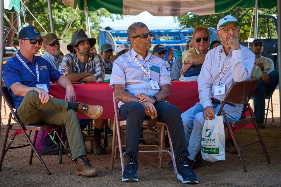 Attendees of the 25th International Pepper Conference at Curry Farms take their seats under tents on a nice sunny day in Pearce, Arizona to listen to the introduction speeches on Tuesday, Sept. 27, 2022.