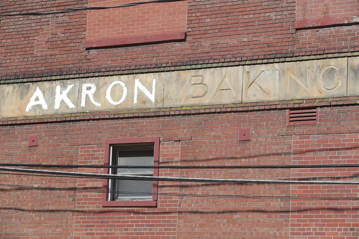 Stonework on the former Wonder Bread and Continental Baking Co. plant reads “The Akron Baking Co.," the original name of the complex. Demolition of the building is expected to conclude this week.