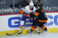 New York Islanders' Brock Nelson (29) and Philadelphia Flyers' Robert Hagg (8) collide during the third period of an NHL hockey game, Sunday, April 18, 2021, in Philadelphia. (AP Photo/Matt Slocum)