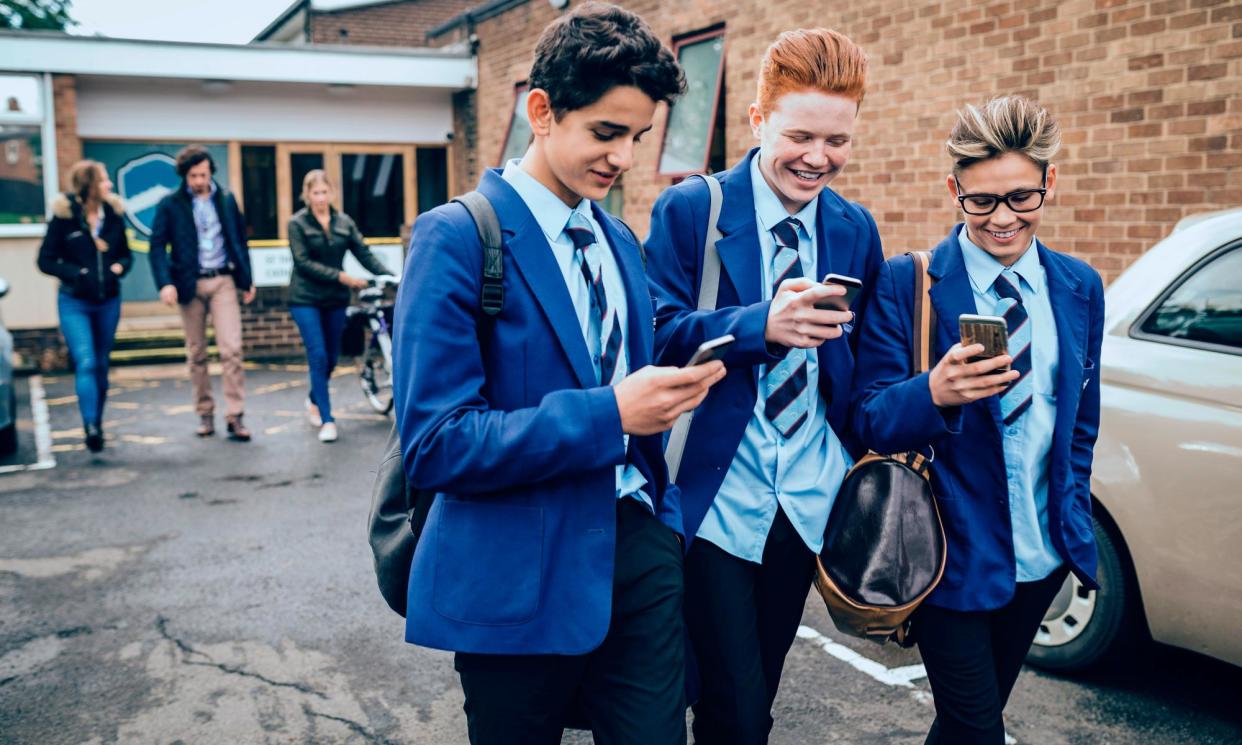 <span>Schools will be able to implement the ban in different ways, from orders to leave all phones at home to allowing pupils to keep them on condition they are not used or heard. </span><span>Photograph: SolStock/Getty Images</span>