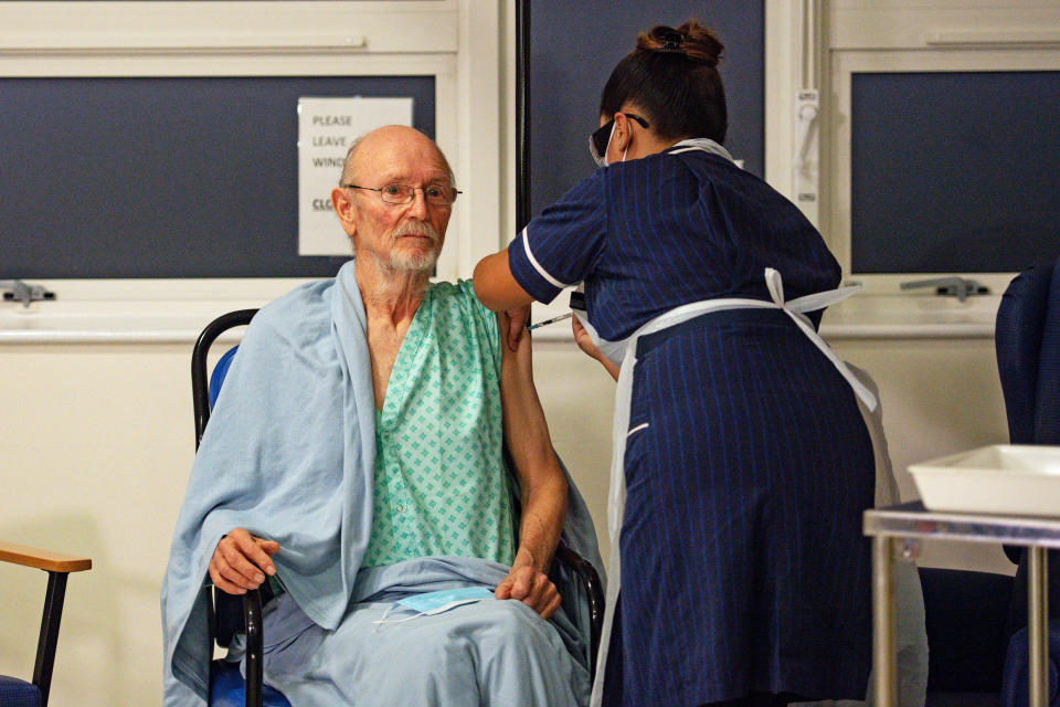 "Bill" William Shakespeare, 81, receives the Pfizer/BioNTech covid-19 vaccine at University Hospital, Coventry, at the start of the largest ever immunisation programme in the UK's history.