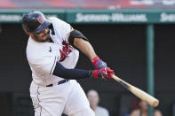 Cleveland Indians' Rene Rivera hits a two-run double in the ninth inning of a baseball game against the Seattle Mariners, Saturday, June 12, 2021, in Cleveland. (AP Photo/Tony Dejak)