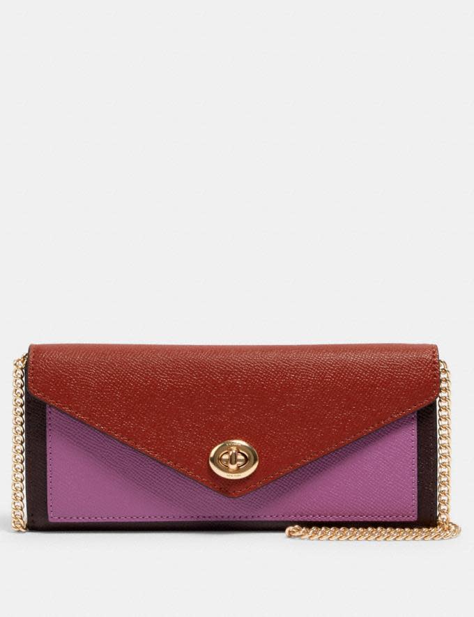 Slim Envelope Wallet With Chain In Colorblock is on sale now through Coach Outlet, $83 (originally $278).