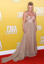 Without a doubt, Miranda Lambert was one of the worst-dressed crooners in attendance at this year's CMA Awards. Not only was her Maria Lucia Hohan halterneck dress meant to be worn by a mother-of-the-bride, it's shape forced the Song of the Year winner to walk around with a hunchback all night long. (11/1/2012)