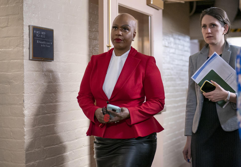 FILE - In this Wednesday, March 11, 2020, file photo, Rep. Ayanna Pressley, D-Mass., and other House Democrats arrive to meet with Speaker of the House Nancy Pelosi, D-Calif., on Capitol Hill in Washington. Democratic lawmakers are calling out an apparent lack of racial data that they say is needed to monitor and address disparities in the national response to the coronavirus outbreak. Massachusetts Sen. Elizabeth Warren and Rep. Ayanna Pressley say in a letter to Health and Human Services Secretary Alex Azar dated Friday, March 27, 2020, that comprehensive demographic data on people who are tested or treated for the coronavirus does not exist. (AP Photo/J. Scott Applewhite, File)