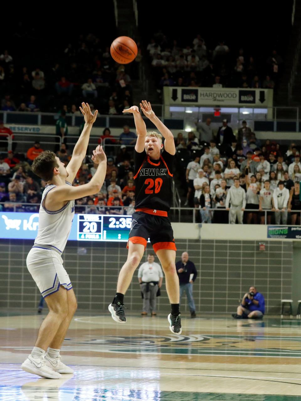 Bentley Hanson shoots a 3-pointer during New Lexington's 54-46 overtime loss to Vincent Warren in a Division II district final on Saturday at the Ohio Convocation Center in Athens. New Lex wrapped up a 21- season that ended one win shy of its first district title in 26 years.